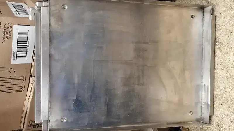 Commercial oven after laser cleaning - clean stainless steel surface restored to food-safe condition